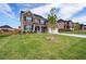 Attractive brick home with a well-groomed lawn and beautiful landscaping at 3236 Papyrus Palm Rd, Loganville, GA 30052