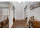 Spacious foyer with high ceilings, hardwood floors, and natural light from a transom window at 3236 Papyrus Palm Rd, Loganville, GA 30052