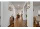 Bright hallway with hardwood floors leading to multiple rooms in the house at 3236 Papyrus Palm Rd, Loganville, GA 30052
