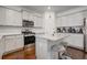 Modern kitchen featuring stainless appliances, island with barstool seating and granite countertops at 3236 Papyrus Palm Rd, Loganville, GA 30052