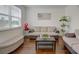 Inviting living room featuring a comfortable sofa, stylish decor, and ample natural light at 3236 Papyrus Palm Rd, Loganville, GA 30052