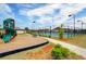 Community playground with a slide and play area, next to the tennis court at 3236 Papyrus Palm Rd, Loganville, GA 30052