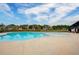 Community pool with clear blue water and lounge area at 3236 Papyrus Palm Rd, Loganville, GA 30052