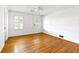 Bedroom showcasing hardwood floors, natural light, and neutral paint at 3605 Sewell Mill Rd, Marietta, GA 30062