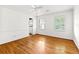 Bright bedroom with hardwood floors, two large windows and neutral color scheme at 3605 Sewell Mill Rd, Marietta, GA 30062