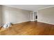 Spacious living room with hardwood floors and a doorway that leads to another room at 3605 Sewell Mill Rd, Marietta, GA 30062