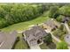 Stunning home aerial view overlooking lush green golf course and mature trees at 44 Kingsford Xing, Acworth, GA 30101