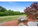 Enjoy the view from this relaxing deck that overlooks the lush backyard and green golf course at 44 Kingsford Xing, Acworth, GA 30101