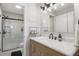 Modern bathroom with white marble vanity, sleek mirror, and glass-enclosed shower at 44 Kingsford Xing, Acworth, GA 30101