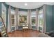 Sunlit bedroom showcasing the home's tranquil outdoor views through a windowed bay with curtain at 44 Kingsford Xing, Acworth, GA 30101