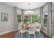 Cozy breakfast nook featuring a round table, stylish chandelier and backyard views at 44 Kingsford Xing, Acworth, GA 30101