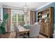 Formal dining room with hardwood floors, large windows and modern light fixture at 44 Kingsford Xing, Acworth, GA 30101