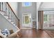 Welcoming foyer with hardwood floors, staircase and view to the outside at 44 Kingsford Xing, Acworth, GA 30101