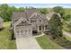 Charming two-story home with a two-car garage and beautifully landscaped front yard at 44 Kingsford Xing, Acworth, GA 30101