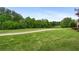 View of the lush green golf course and surrounding mature trees creates a scenic setting at 44 Kingsford Xing, Acworth, GA 30101