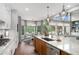 Spacious kitchen island with seating area, stainless appliances, and open access to the breakfast nook and living room at 44 Kingsford Xing, Acworth, GA 30101