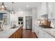 Gourmet kitchen with stainless appliances, kitchen island with seating and marble countertops and backsplash at 44 Kingsford Xing, Acworth, GA 30101
