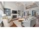 Open concept living room with fireplace, built-ins, hardwood floors, and cozy seating at 44 Kingsford Xing, Acworth, GA 30101