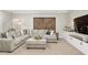 Comfortable living room with large sectional sofa and custom entertainment center at 44 Kingsford Xing, Acworth, GA 30101