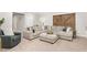 Spacious living room featuring a large sectional sofa and a cozy ottoman at 44 Kingsford Xing, Acworth, GA 30101