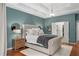 Luxurious main bedroom features tray ceilings, an ensuite bath, and elegant furnishings for ultimate comfort at 44 Kingsford Xing, Acworth, GA 30101