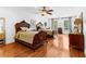 Spacious bedroom with hardwood floors, two beds, a ceiling fan, and natural light at 1477 Highway 85 Connector, Brooks, GA 30205
