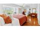 Bright bedroom with natural light, hardwood floors, and neutral toned walls and decor at 1477 Highway 85 Connector, Brooks, GA 30205