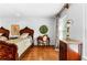 Spacious bedroom with hardwood floors, two beds, a ceiling fan, natural light, and furniture at 1477 Highway 85 Connector, Brooks, GA 30205
