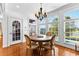 Dining room with large windows offering scenic view, hardwood floors, and natural light at 1477 Highway 85 Connector, Brooks, GA 30205