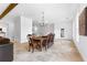 Formal dining room with travertine floors and chandelier at 1477 Highway 85 Connector, Brooks, GA 30205