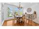 Bright dining area with hardwood floors, large windows, and elegant chandelier at 1477 Highway 85 Connector, Brooks, GA 30205