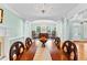 Open-concept dining room featuring a chandelier and elegant columns at 1477 Highway 85 Connector, Brooks, GA 30205
