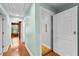 Hallway featuring an elevator to other floors with light green walls and wood flooring at 1477 Highway 85 Connector, Brooks, GA 30205