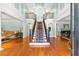 Grand foyer with a stunning staircase, hardwood floors, and elegant decor at 1477 Highway 85 Connector, Brooks, GA 30205