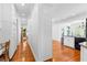 Bright hallway featuring wood floors, crisp molding, and access to multiple rooms at 1477 Highway 85 Connector, Brooks, GA 30205