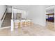 Open-concept kitchenette with breakfast bar, white cabinets, and stainless-steel appliances at 1477 Highway 85 Connector, Brooks, GA 30205
