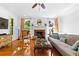 Bright living room features hardwood floors, fireplace and windows at 1477 Highway 85 Connector, Brooks, GA 30205