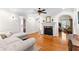 Cozy living room featuring hardwood floors, a fireplace, and ample natural light at 1477 Highway 85 Connector, Brooks, GA 30205