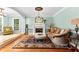 Cozy living room with a fireplace, comfortable seating, and a classic rug at 1477 Highway 85 Connector, Brooks, GA 30205