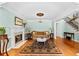Spacious living room with a fireplace, sofa, chandelier, and hardwood flooring at 1477 Highway 85 Connector, Brooks, GA 30205