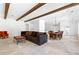 Open-concept living space with wooden beams, dining and living areas at 1477 Highway 85 Connector, Brooks, GA 30205