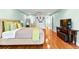 Spacious main bedroom with hardwood floors, built-in shelves, and a comfortable seating area at 1477 Highway 85 Connector, Brooks, GA 30205