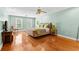 Bright main bedroom with hardwood floors, neutral walls, and ample natural light at 1477 Highway 85 Connector, Brooks, GA 30205