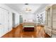 Spacious main bedroom featuring hardwood floors, ceiling fan and ample natural light at 1477 Highway 85 Connector, Brooks, GA 30205