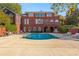 Stunning backyard featuring a pool with an expansive patio and elegant architecture, perfect for luxury living at 1477 Highway 85 Connector, Brooks, GA 30205