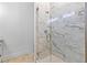 Close-up of shower with clear glass doors and marble-look surround at 1477 Highway 85 Connector, Brooks, GA 30205
