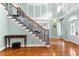 Elegant staircase leading to the second floor, showcasing hardwood floors and architectural details at 1477 Highway 85 Connector, Brooks, GA 30205