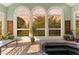 Bright sunroom with large arched windows, tiled floors, and a relaxing jacuzzi tub at 1477 Highway 85 Connector, Brooks, GA 30205