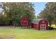 Outdoor haven featuring a playhouse, swing set and barn, ideal for Gathering fun and recreation at 1477 Highway 85 Connector, Brooks, GA 30205