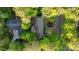 Aerial view showcases the property's layout, mature trees, and desirable location within a quiet neighborhood at 170 Mark Nw Trl, Sandy Springs, GA 30328